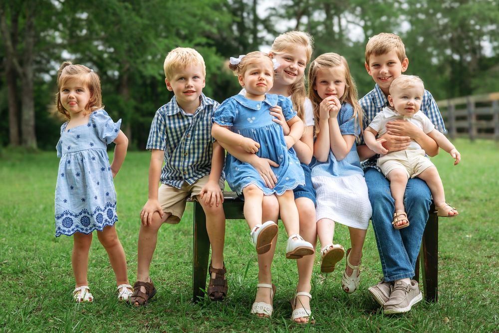 Children from extended family session smiling together during outdoor photoshoot in Athens GA