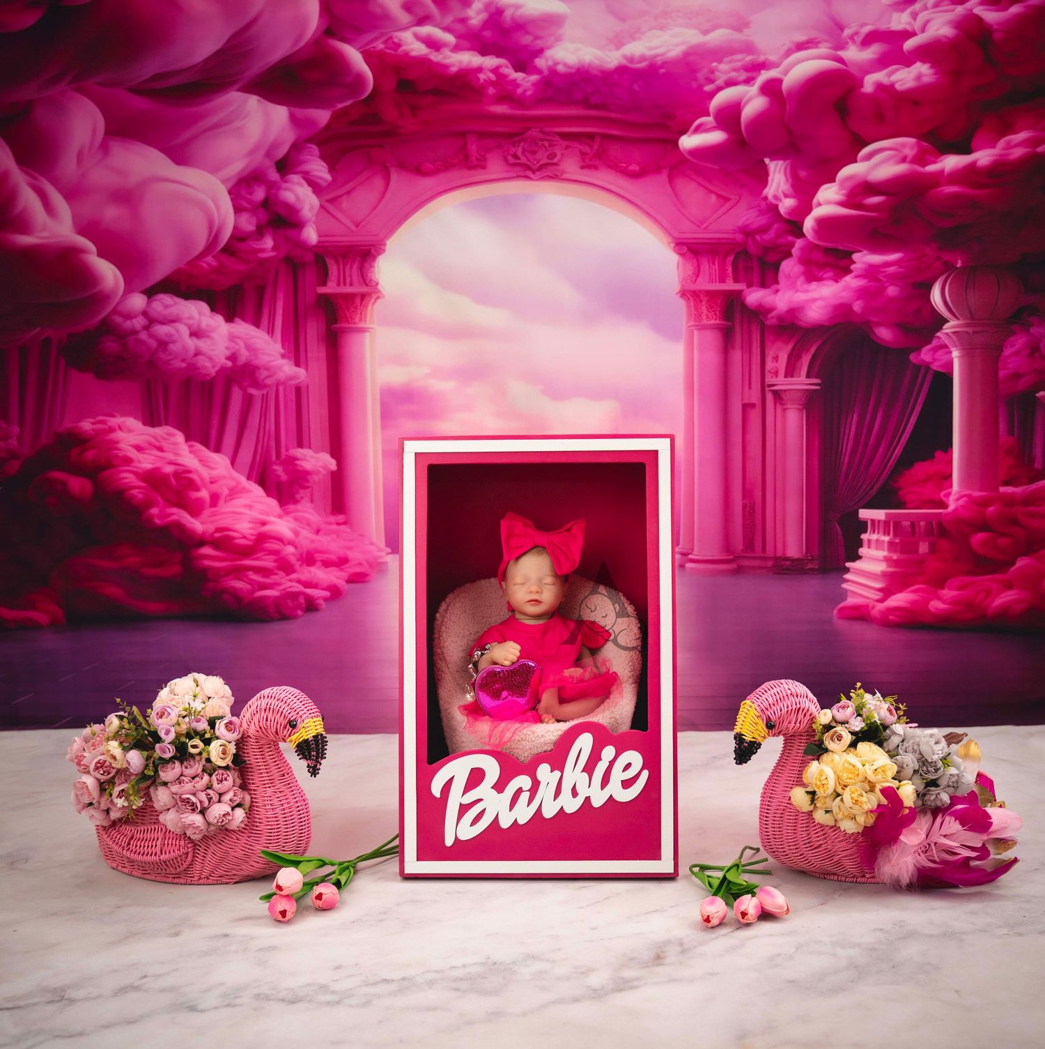 Dramatic pink archway scene with decorative flamingos and floral arrangements.