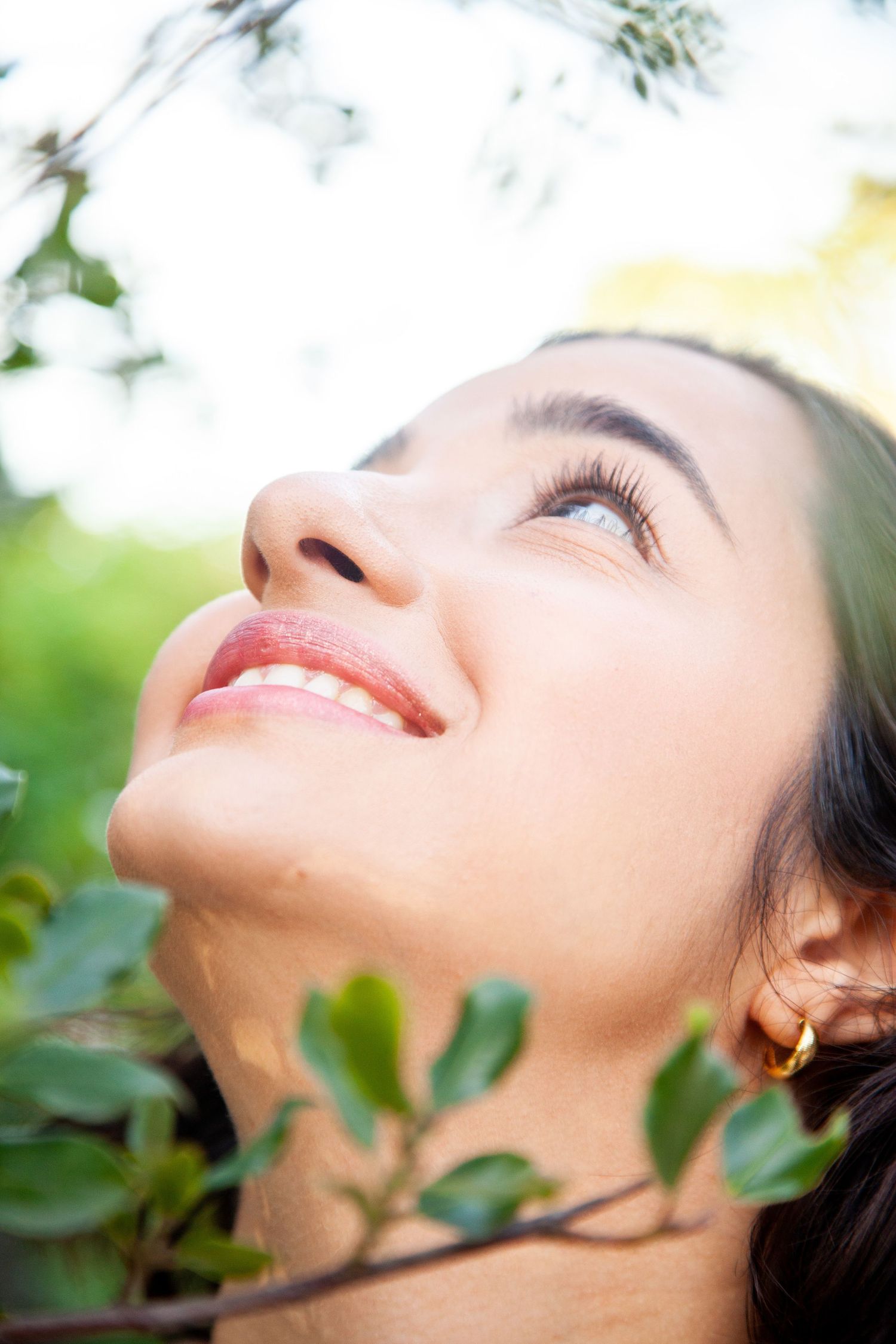 Close-up nature portrait with soft bokeh effect and green foliage background.