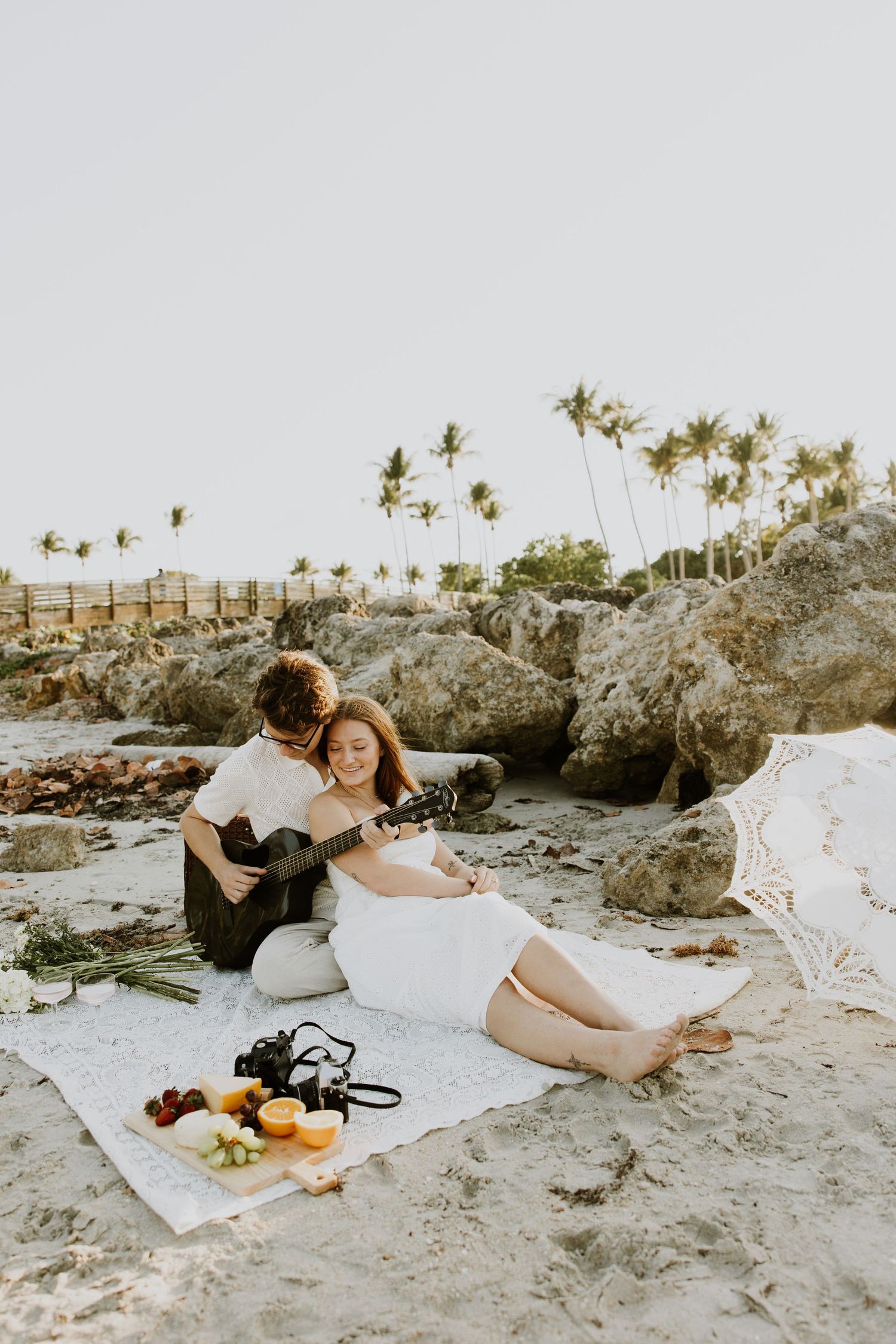 Golden Hour engagement photos of a couple on the beach at Dubois Park in Jupiter, Florida captured by Lindsay McDow Photography