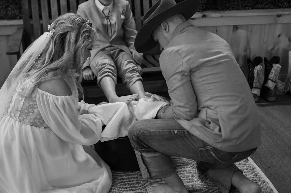 Black and white wedding photography captures intimate dance moments from multiple angles in a heartfelt celebration.