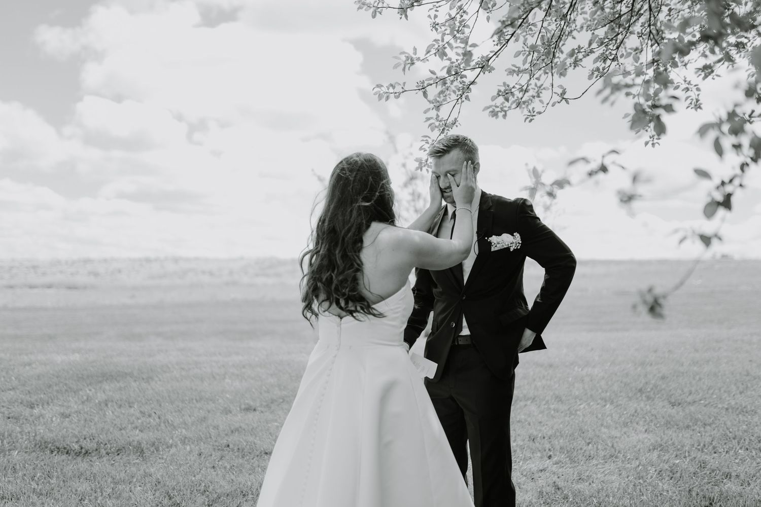 a bride wipes her grooms tears after their share private vows during their first look
