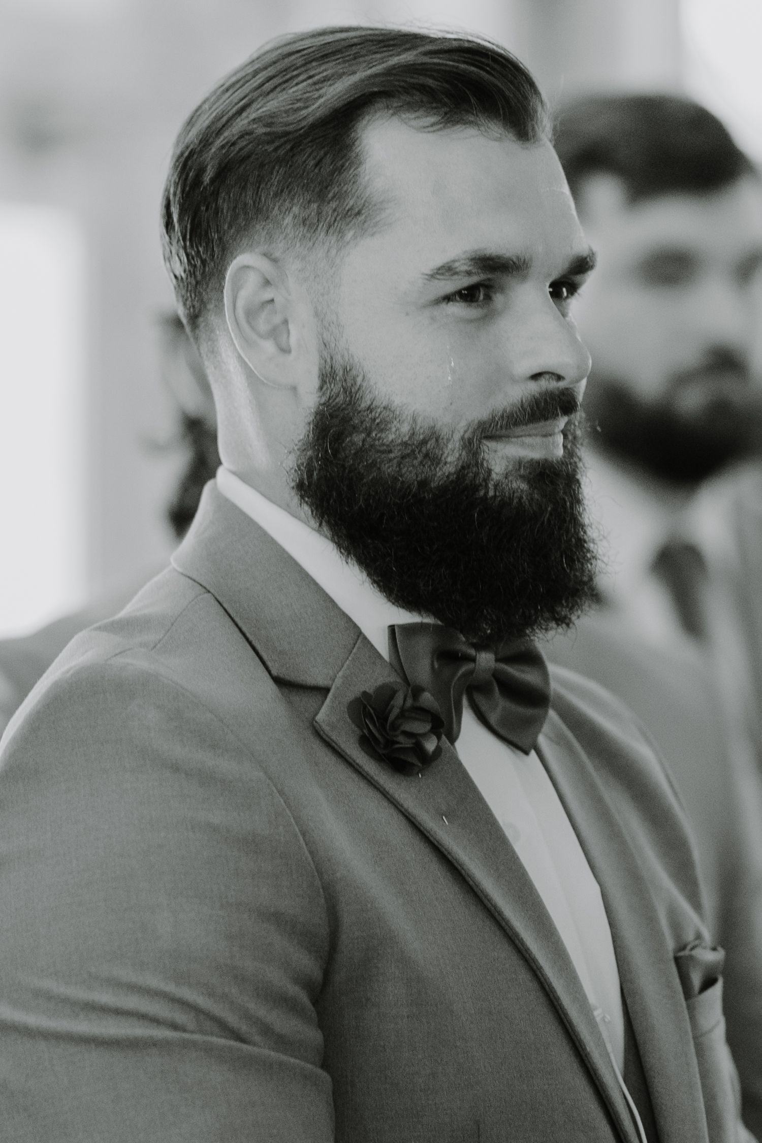 a groom cries as he see his bride walking down the aisle, even after their first look