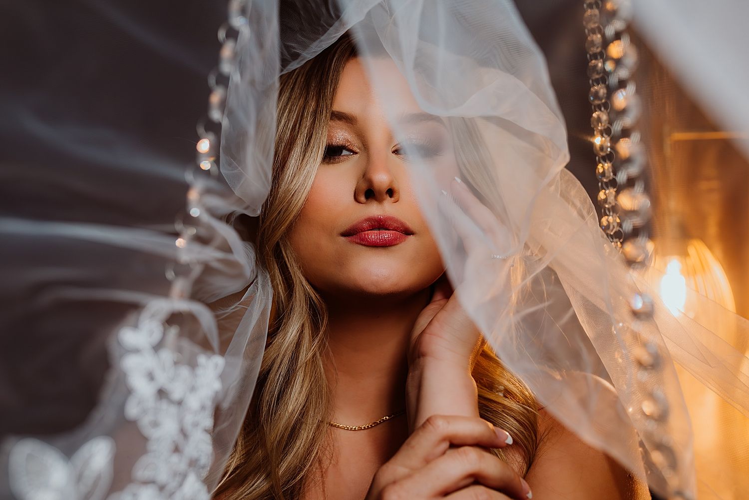 blond wearing veil in studio by Wisconsin boudoir photographer