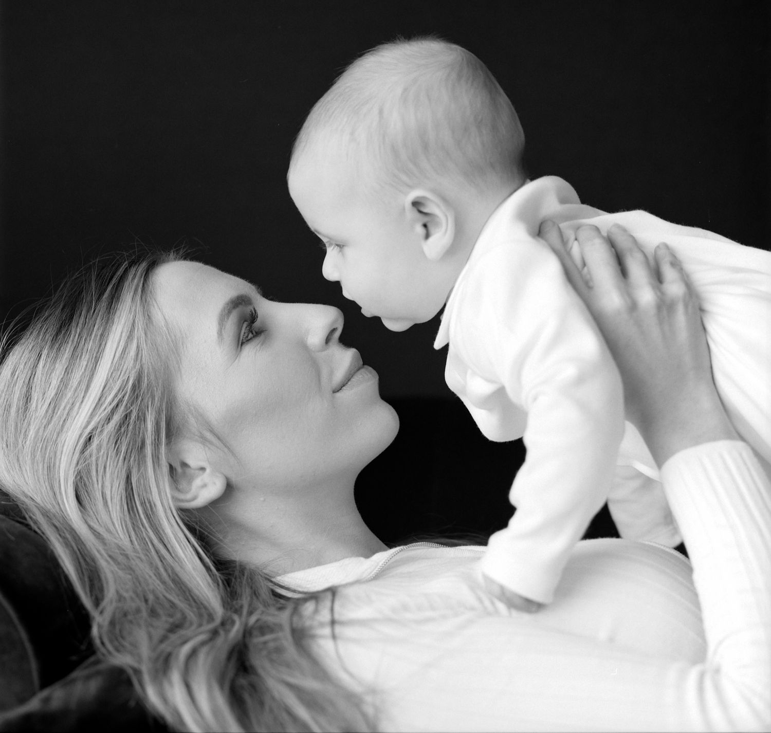 black and white moody portrait of a new mum and her baby