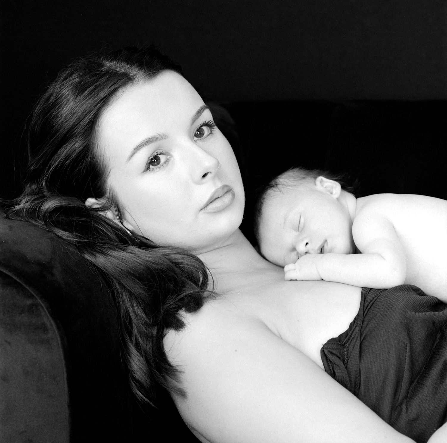black and white moody portrait of a new mum and her baby