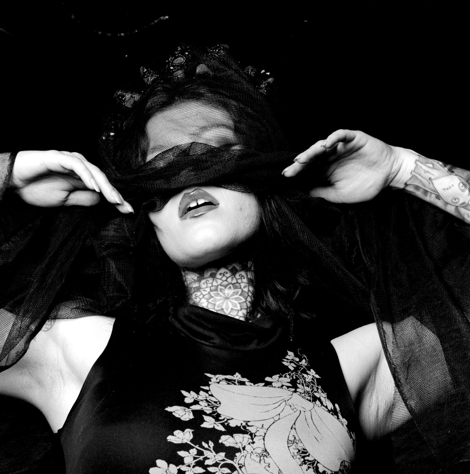 Model Ana Maria Viga shrouded in black fabric