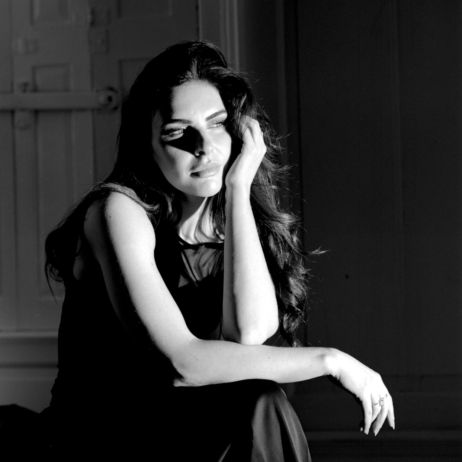 Creative black and white film noir style Portrait Photograph of UK model Alice Bryan