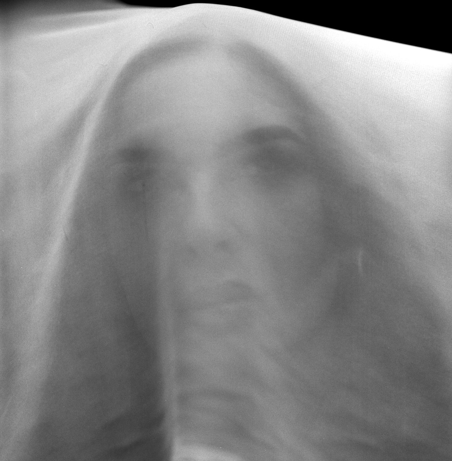 Uk model Alice Bryan photographed through white chiffon fabric