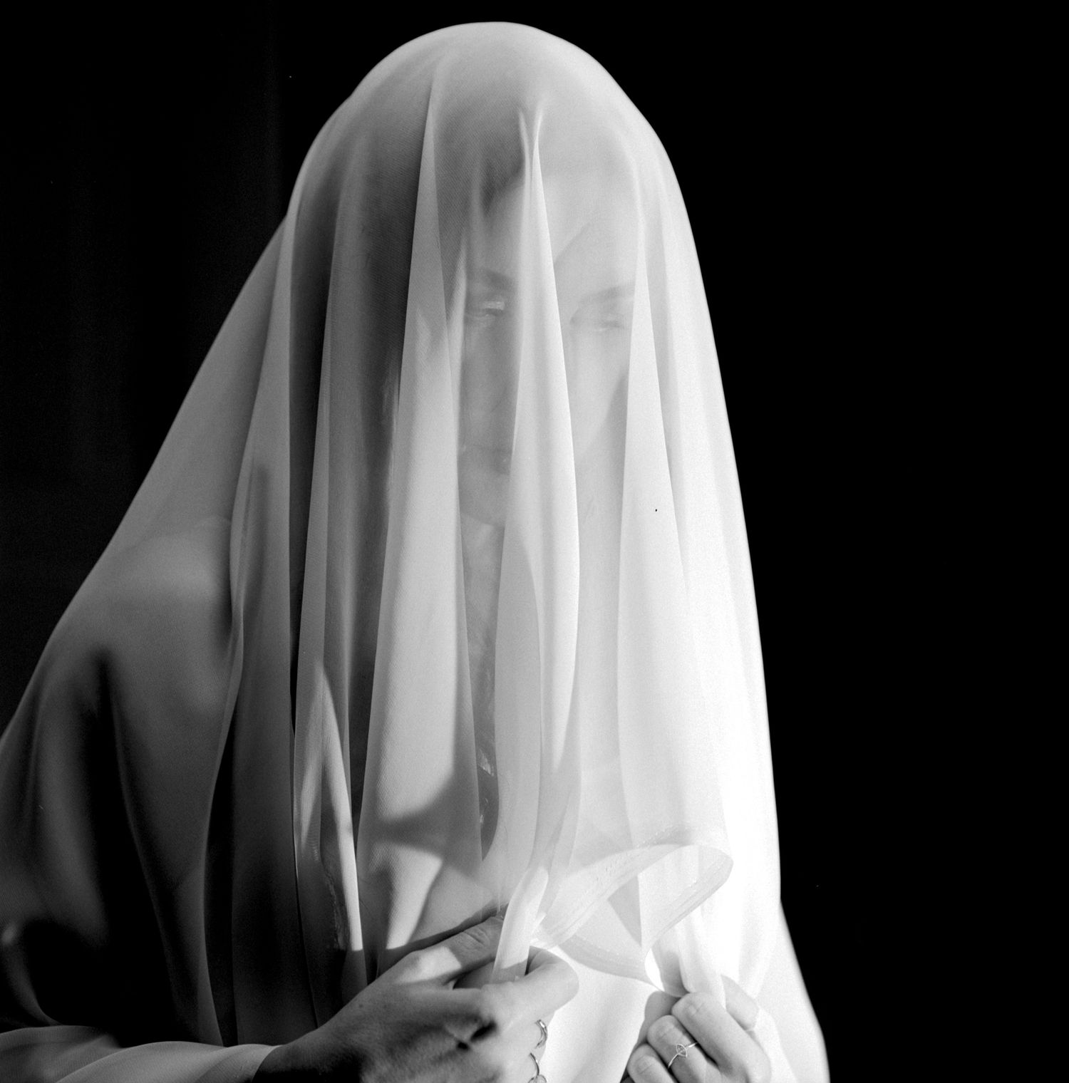 Alice Bryan draped in a white chiffon fabric