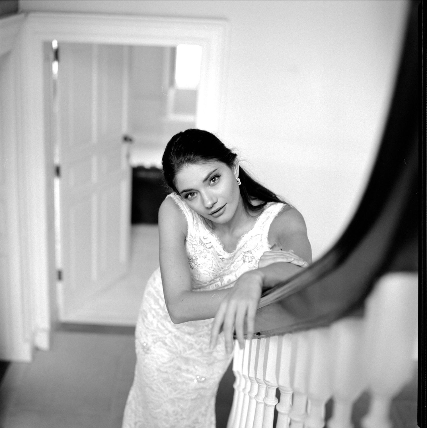 Elle Baldwinson with elegant white gown at The Boardroom Studio