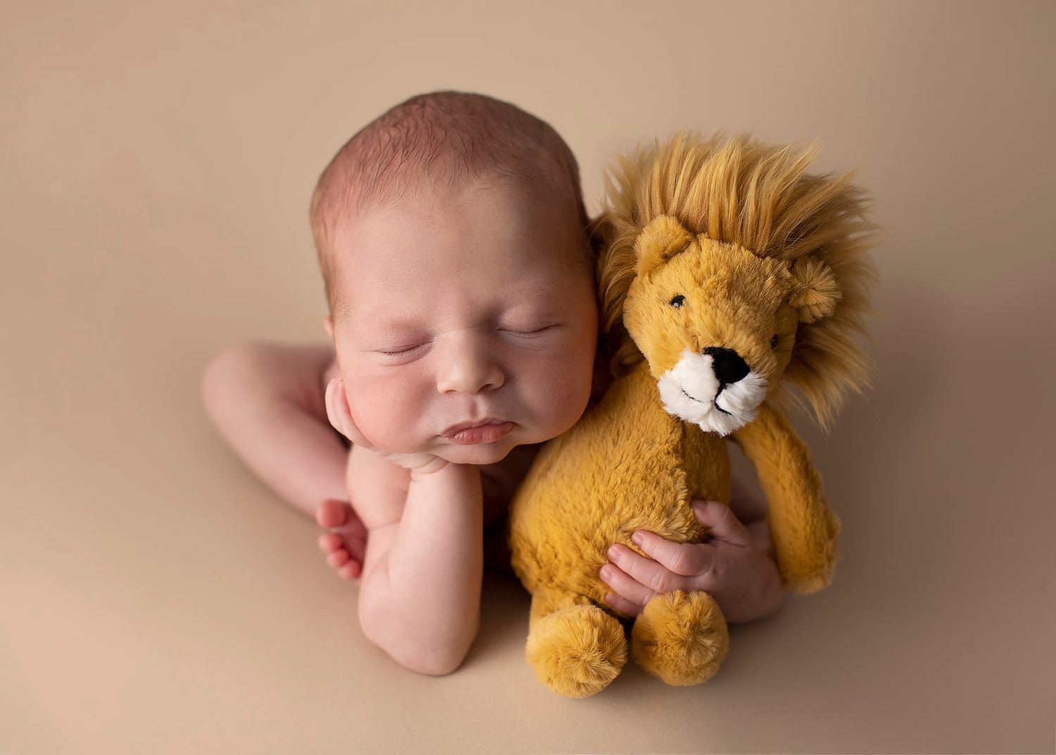Newborn baby girl froggy pose from Elizabeth Lang Photography in Surrey.