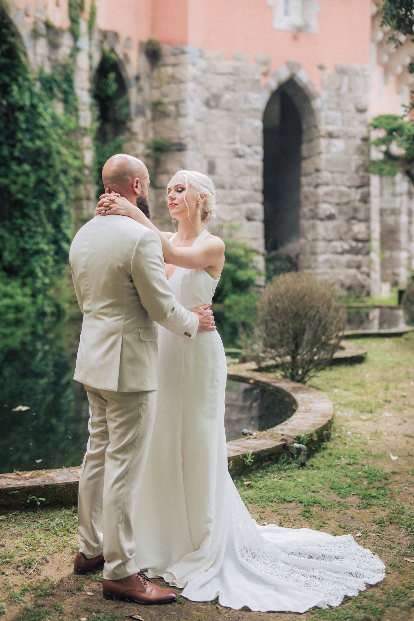 Bride & groom at Casa dos Penedos, a wedding venue from Penha Longa Catering. A romantic moment captured by a Portugal wedding photographer.