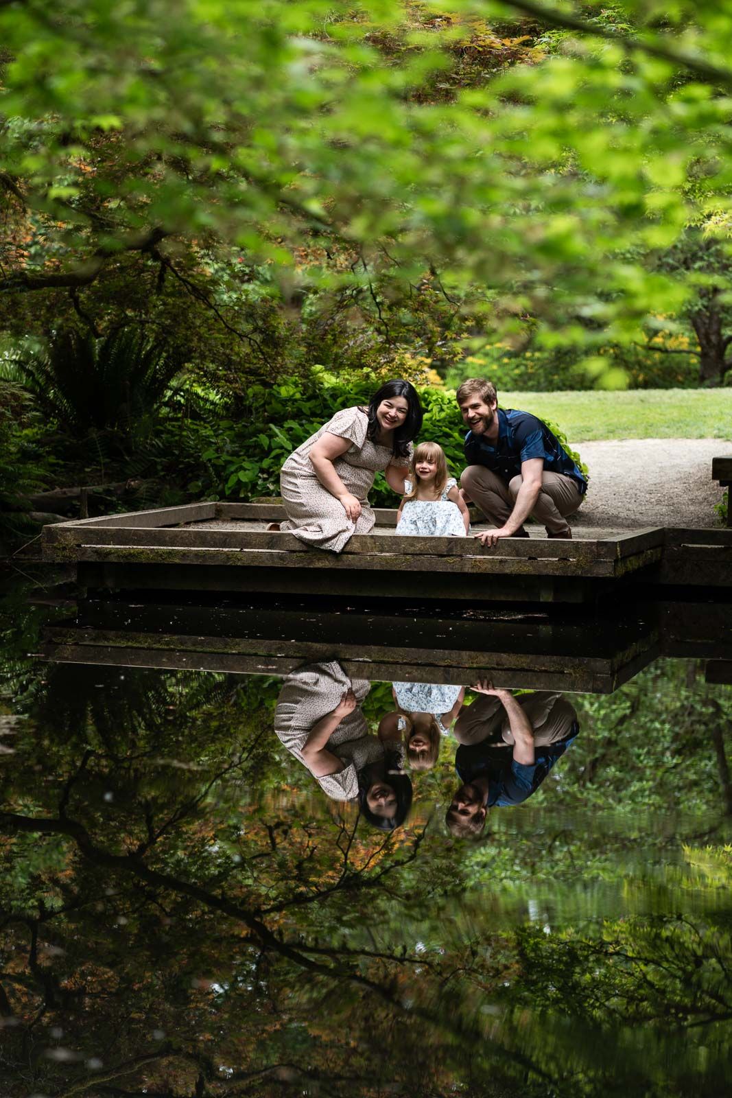 Family looking at the reflection pond in Seattle.