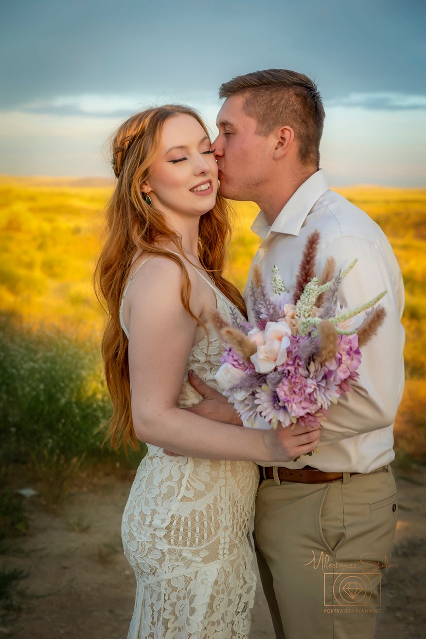 Wedding portrait with pink and purple bouquet