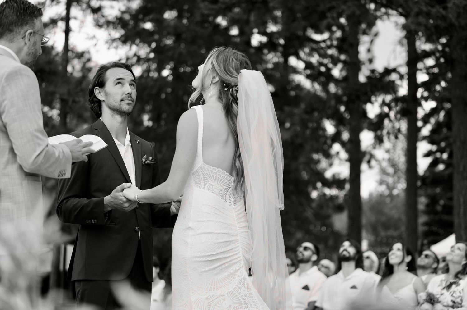 A collection of black and white wedding photos showing couples dancing gracefully at different outdoor reception celebrations.