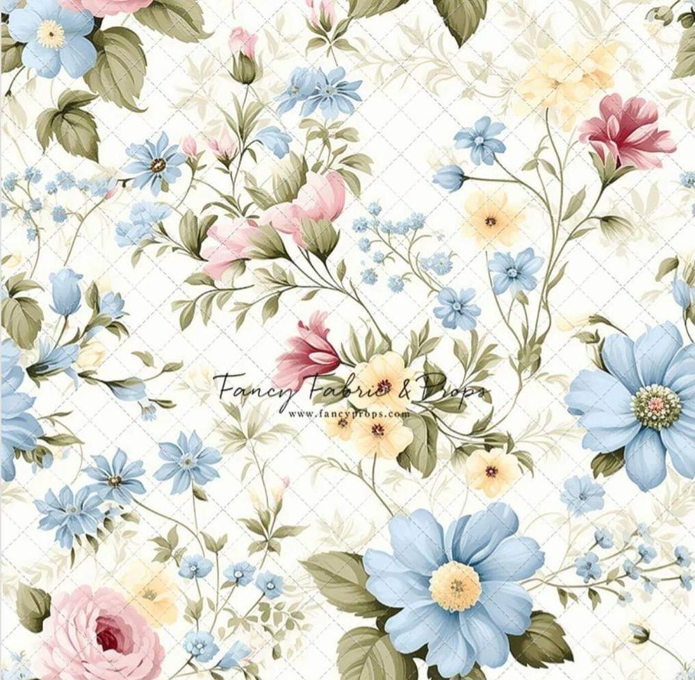 Delicate vintage floral pattern with light blue daisies, pink roses, and green foliage on a cream damask background.