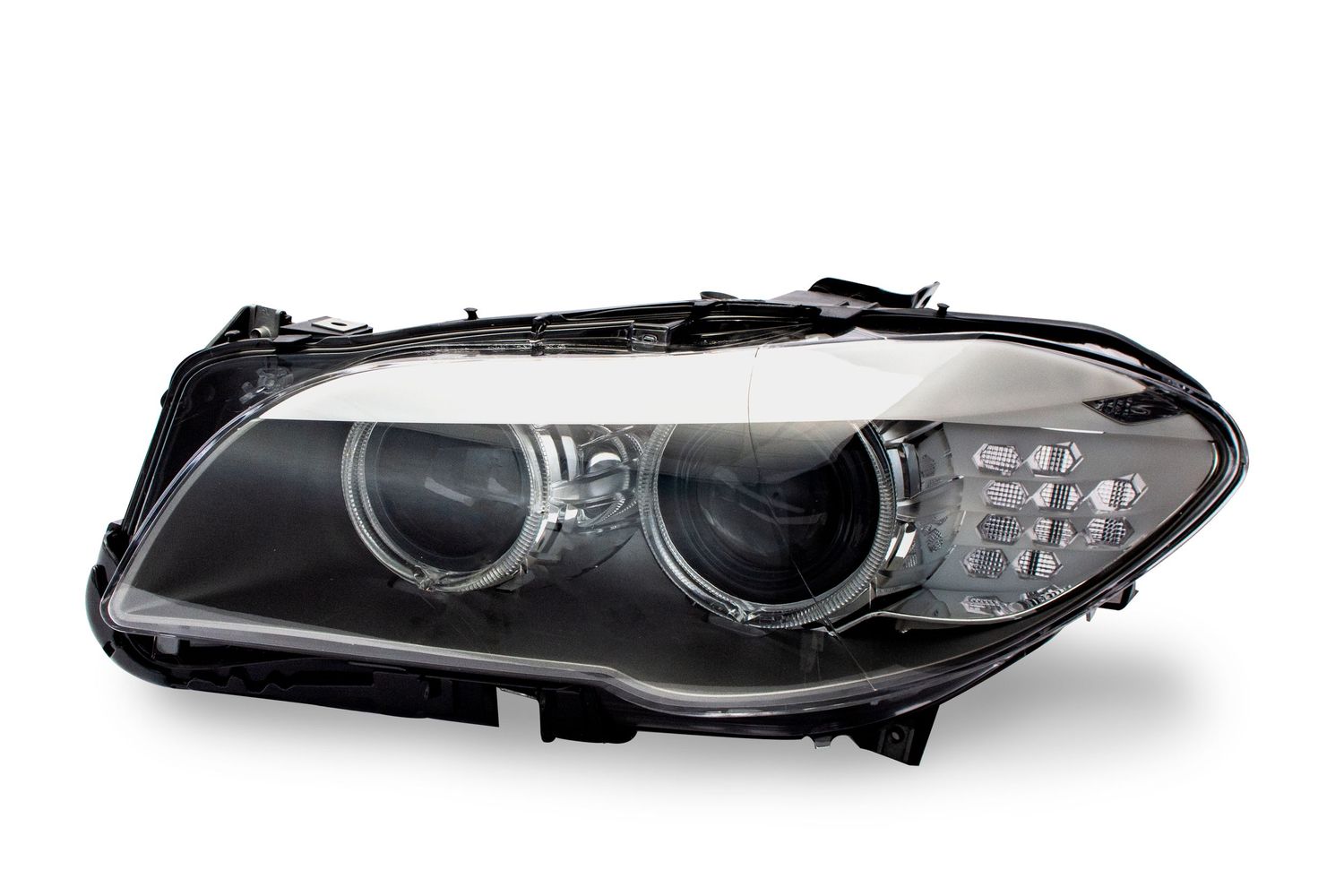 Modern black BMW headlight assembly with xenon projector lens and LED accents.