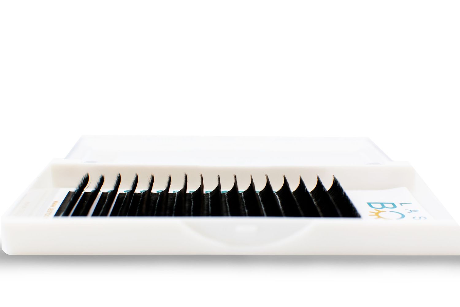 White case containing rows of black eyelash extensions for professional beauty applications.