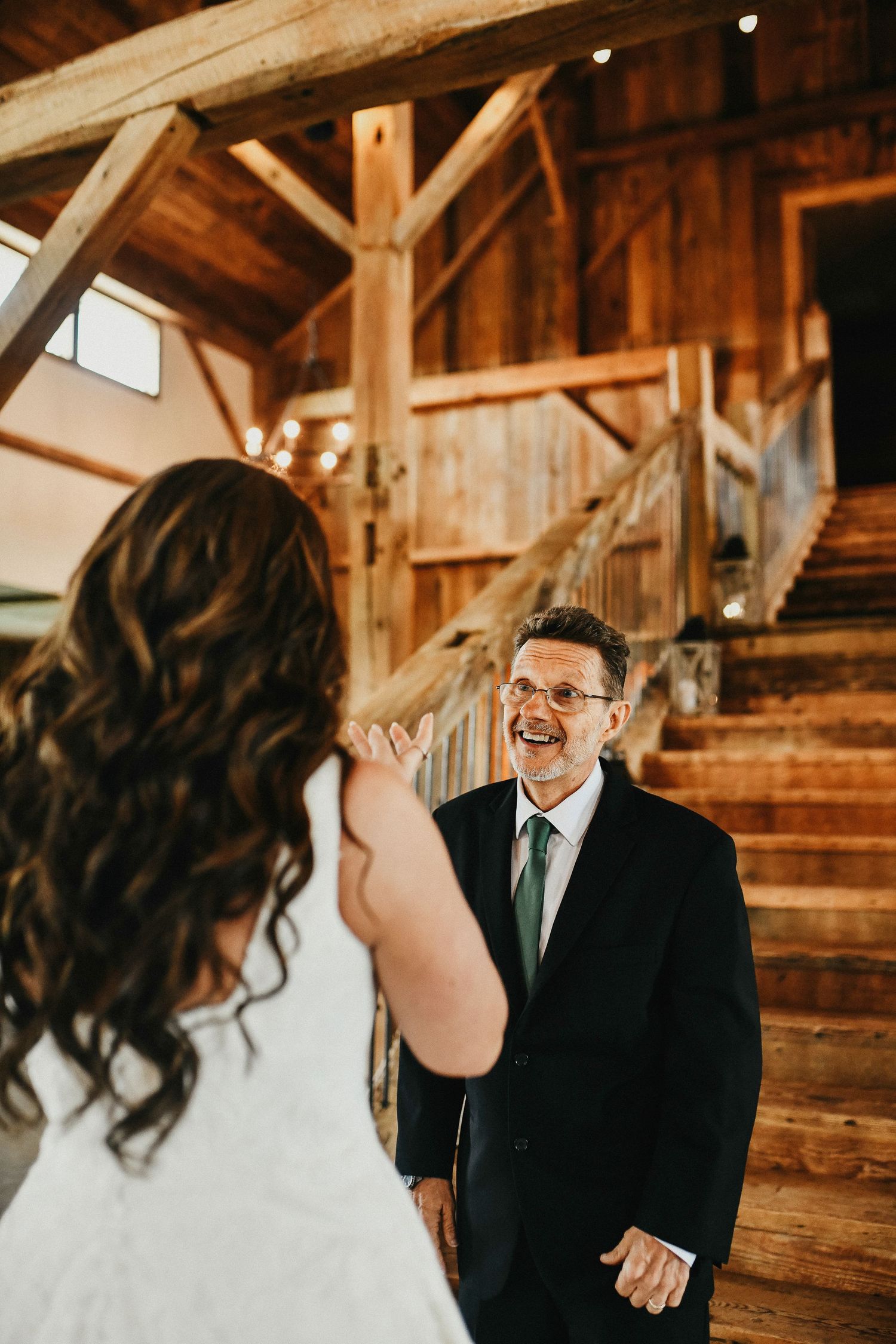 a sweet photo of the father of the bride seeing her for the first time on her wedding day