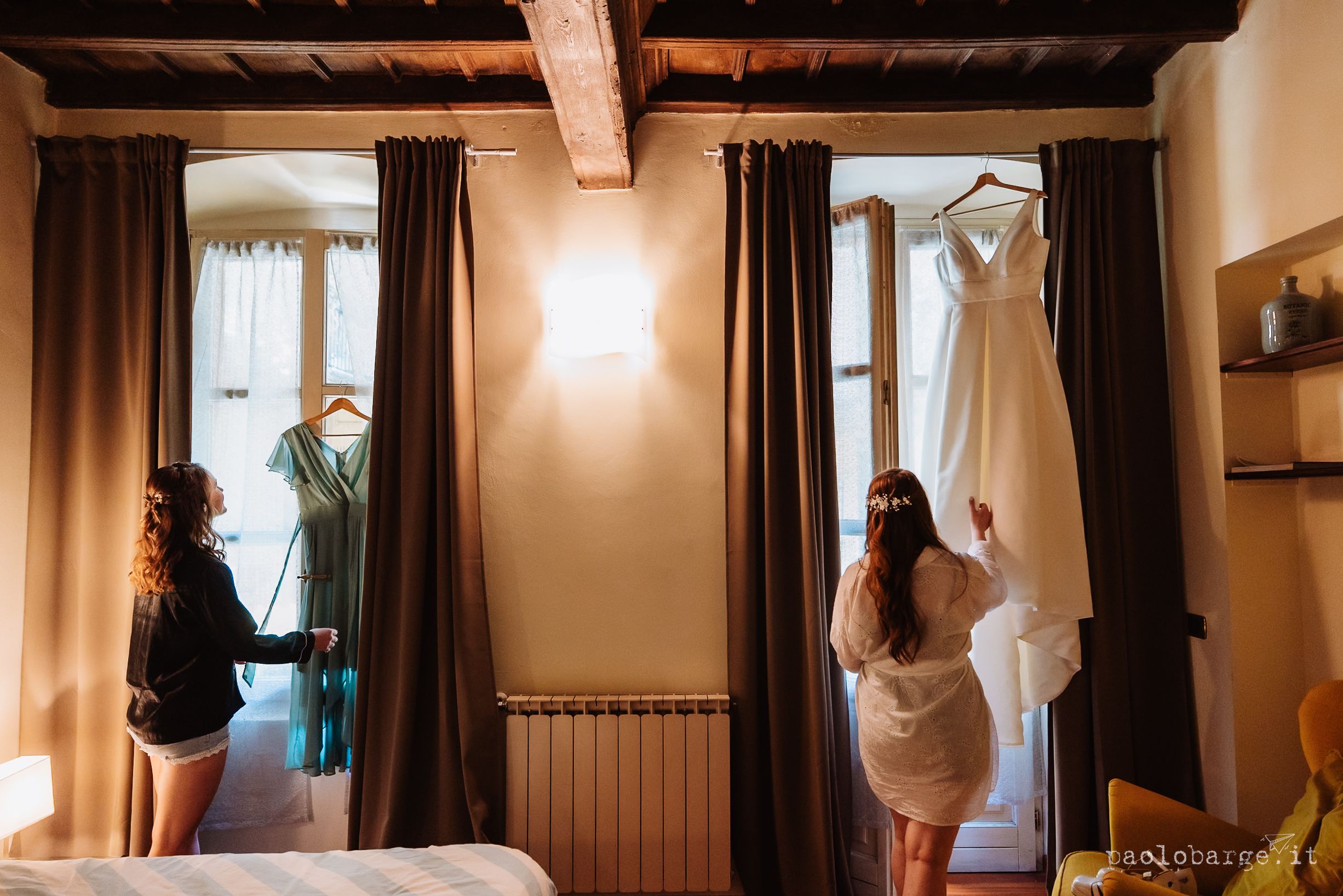 Interior panorama of a cozy wedding venue with warm lighting, rustic decor, and elegant drapery.