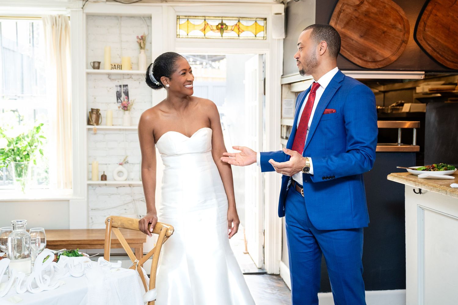 Wedding celebration in bright modern kitchen with rustic details.