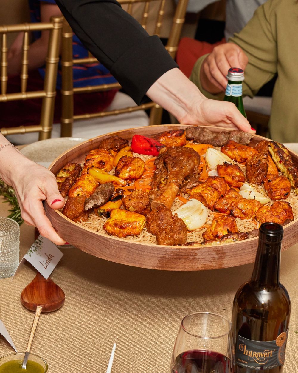 Shared platter of food served during Bat Mitzvah dinner in Brooklyn. Warm, cultural detail captured by George Robert Photography.