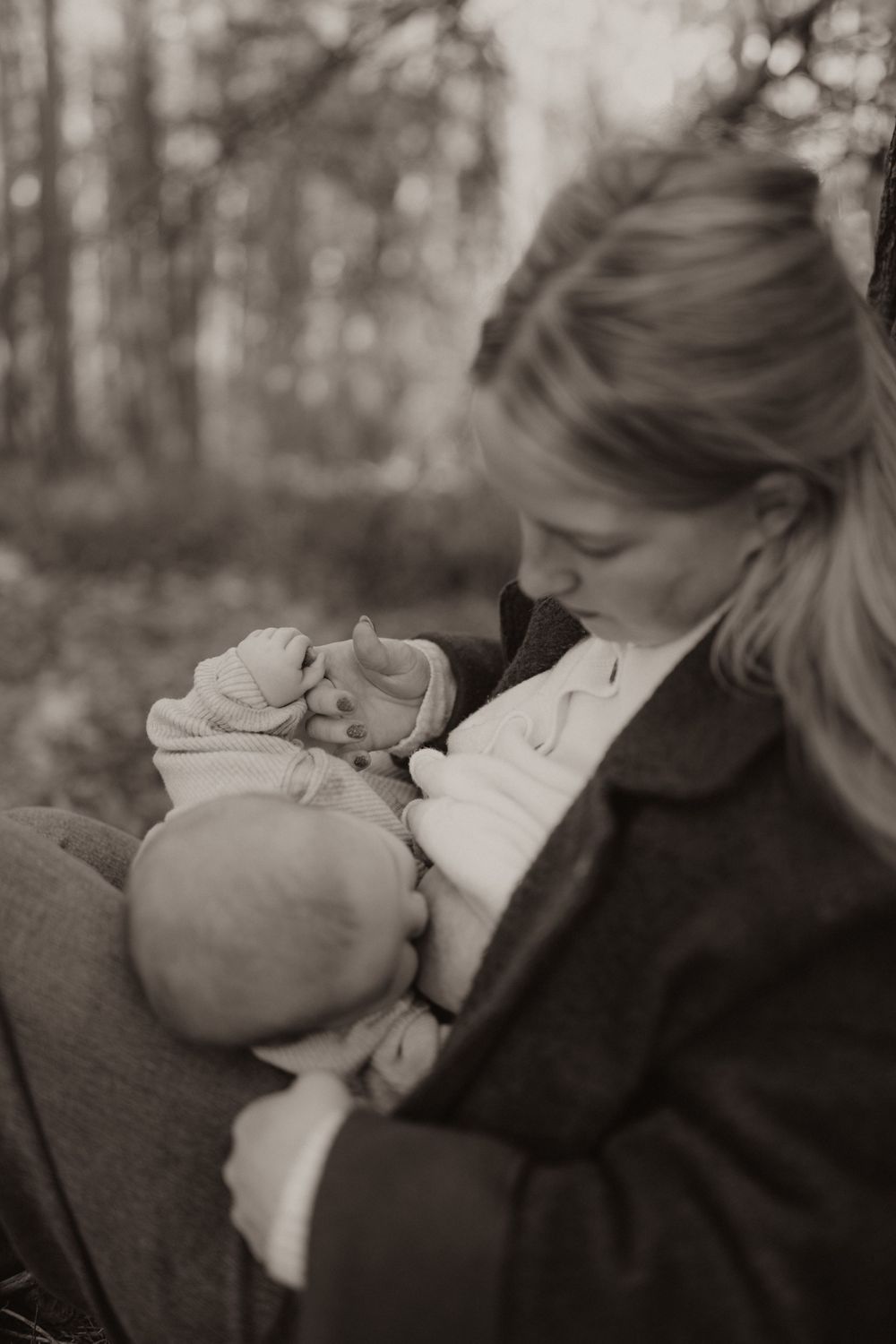 A candid black and white photo series showing tender moments between a parent and baby.