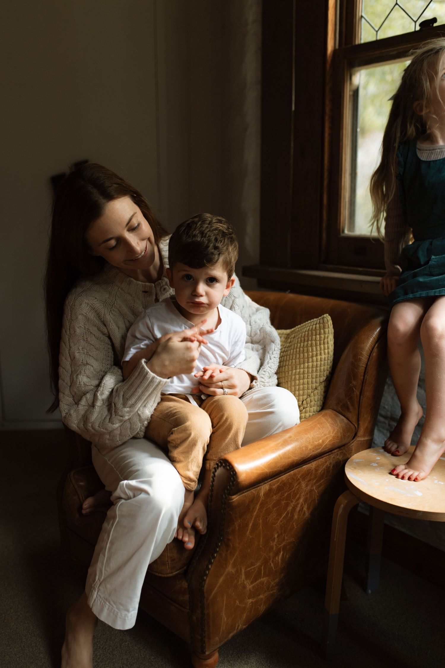 Storytelling photograph of mother and son on a chair
