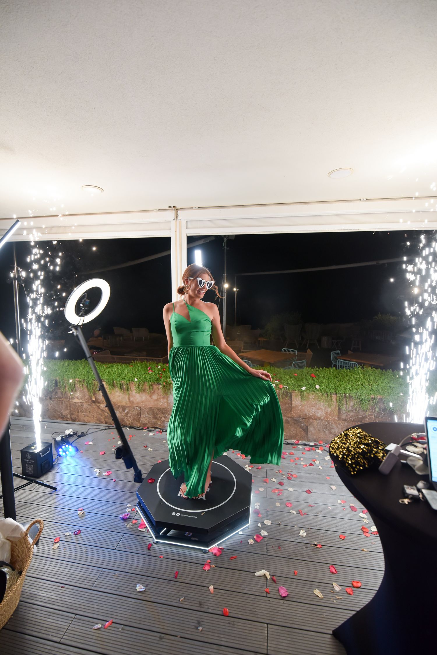 Girl with green dress making a 360 video with cold spark machines at a wedding in ibiza at 7 Pines Ibiza