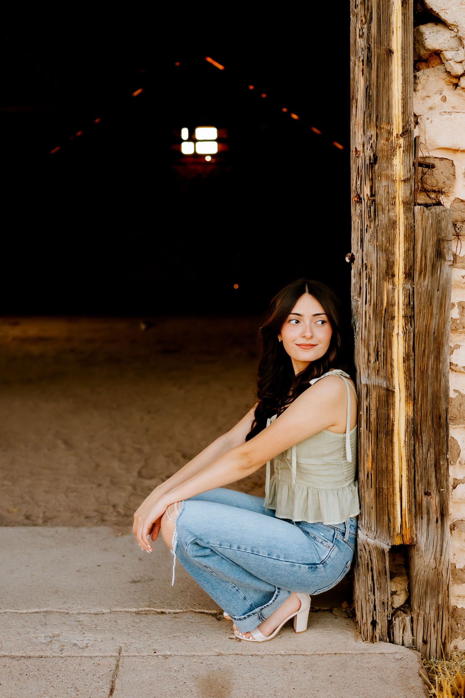 Portrait of senior girl in abandoned barn in Sonoita near Tucson