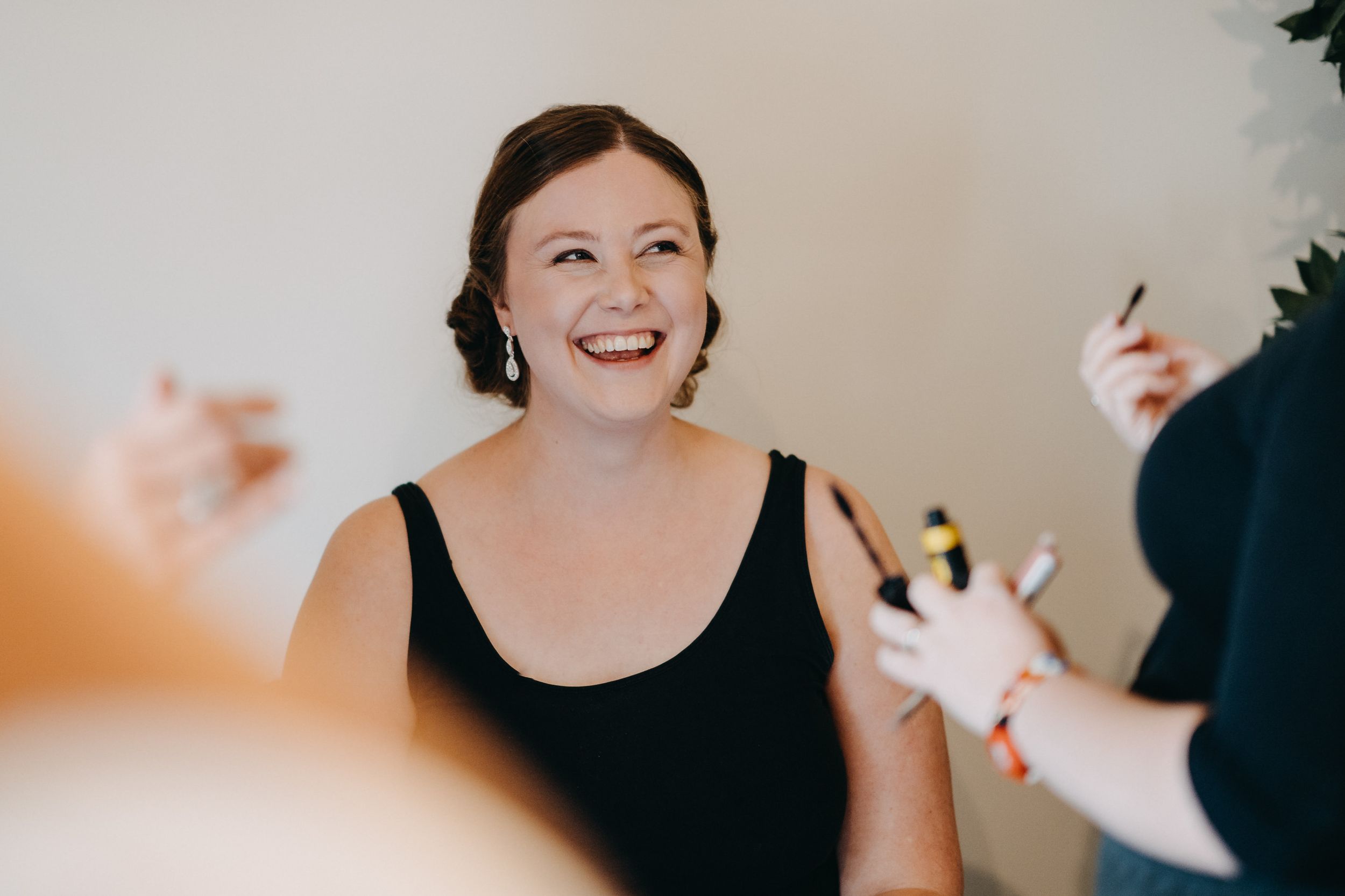 Candid celebration moment at a wedding with joyful expressions and laughter.