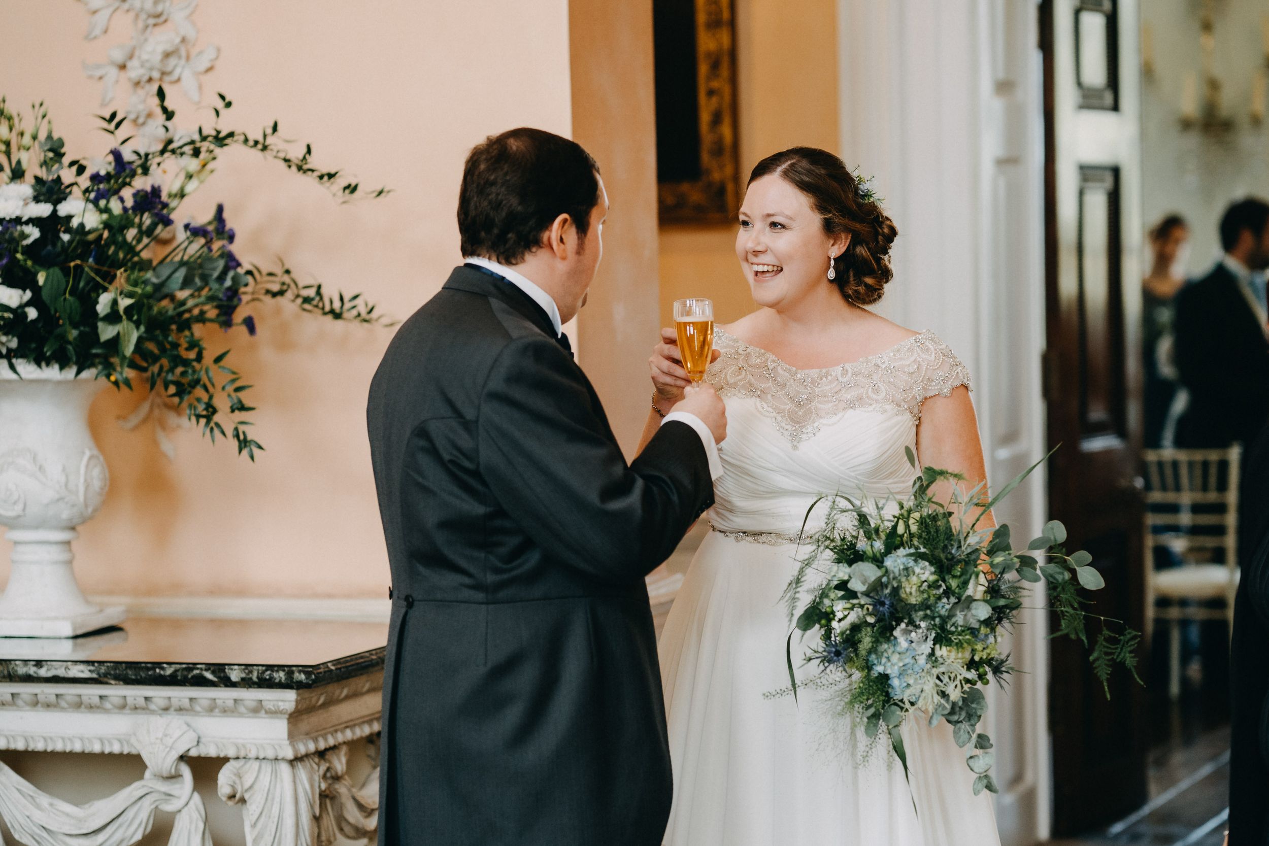 A magical wedding moment shared between newlyweds with beautiful floral arrangements in the background.