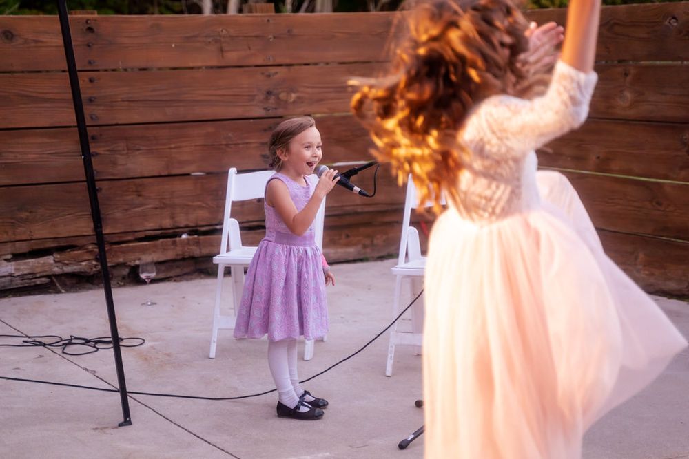 A fall West Michigan DIY backyard wedding reception dance party with karaoke by the guests.