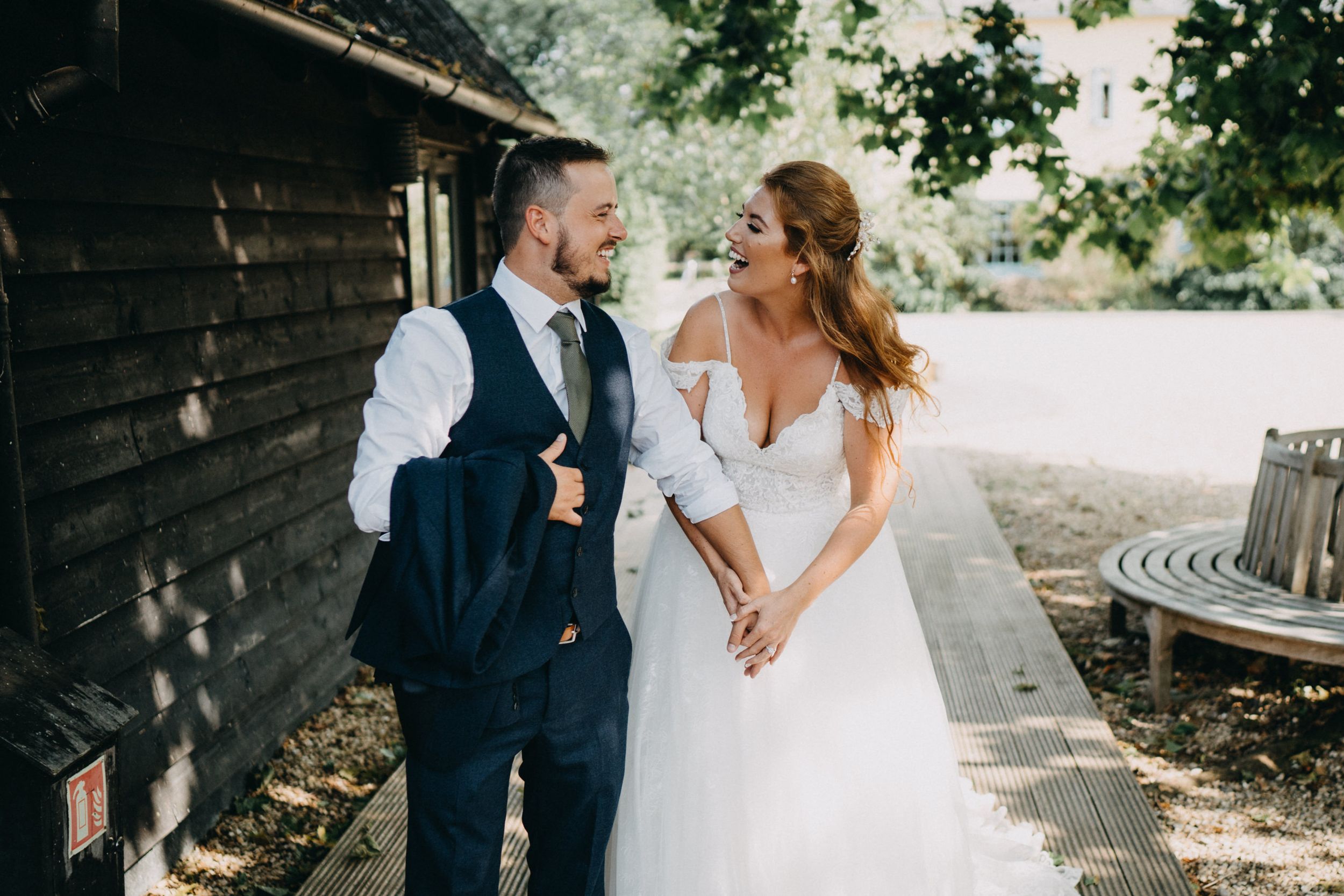 Couple sharing intimate moment together outdoors during their wedding celebration.