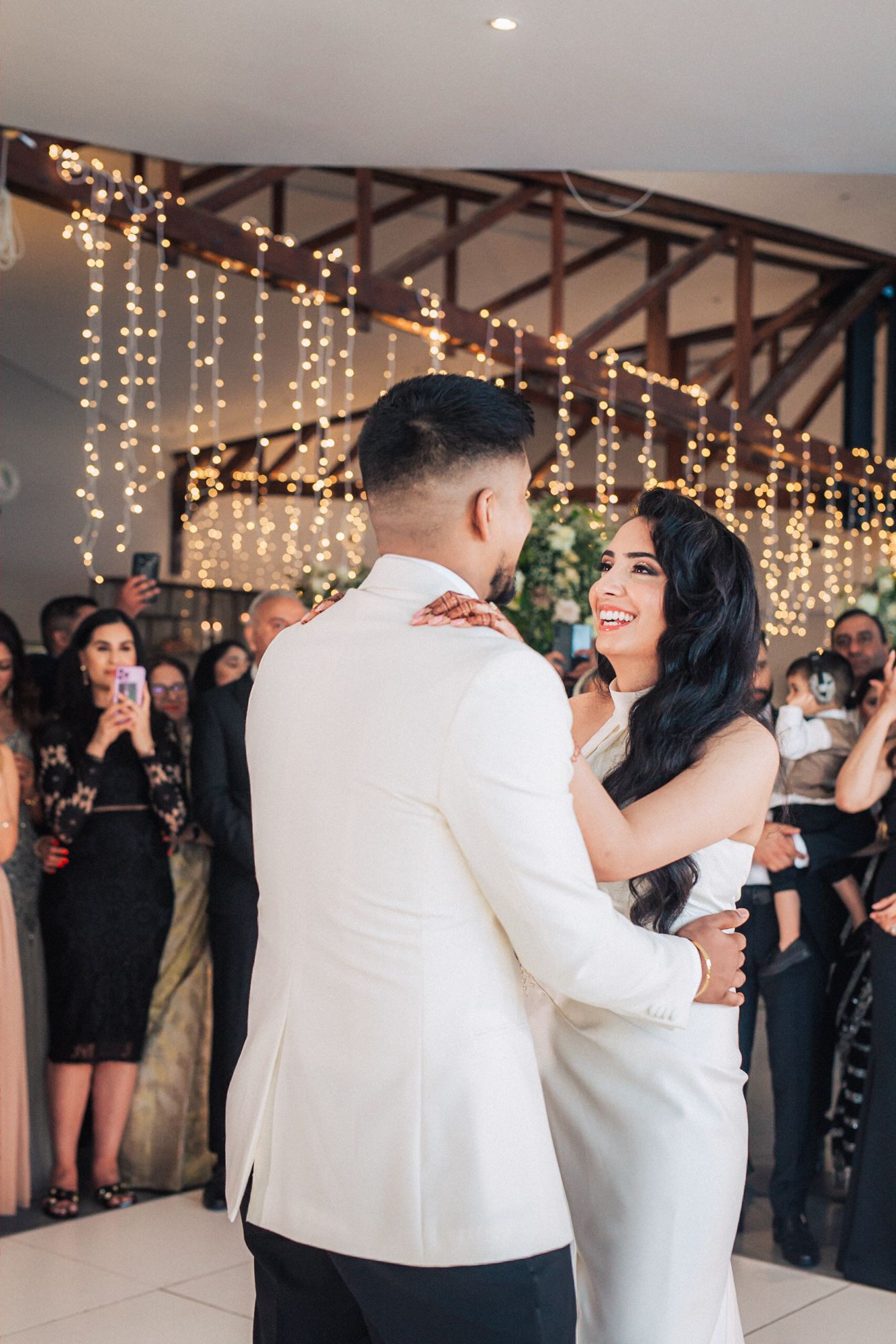 romance on the dance floor as the couple shares their first dance at a Destination Indian Wedding in Portugal in Arriba by the sea venue