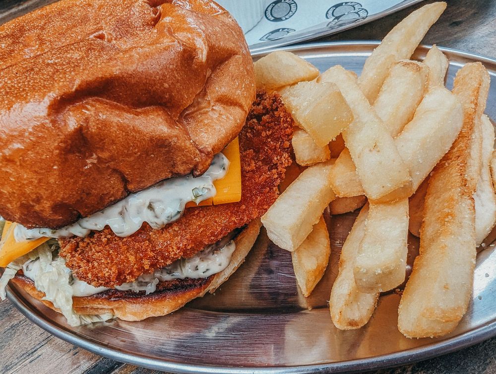 Crispy chicken sandwich with fries on metal serving tray. SIX84 Photography, Event Photography, Sydney