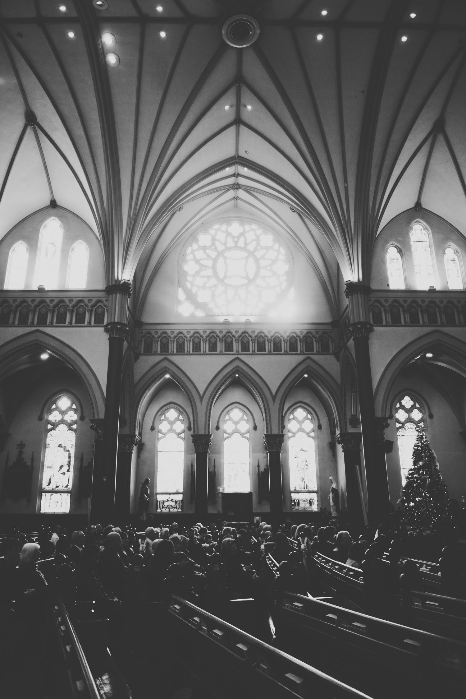 black and white photo of the interior wall and windows in st andrews cathedral in victoria bc