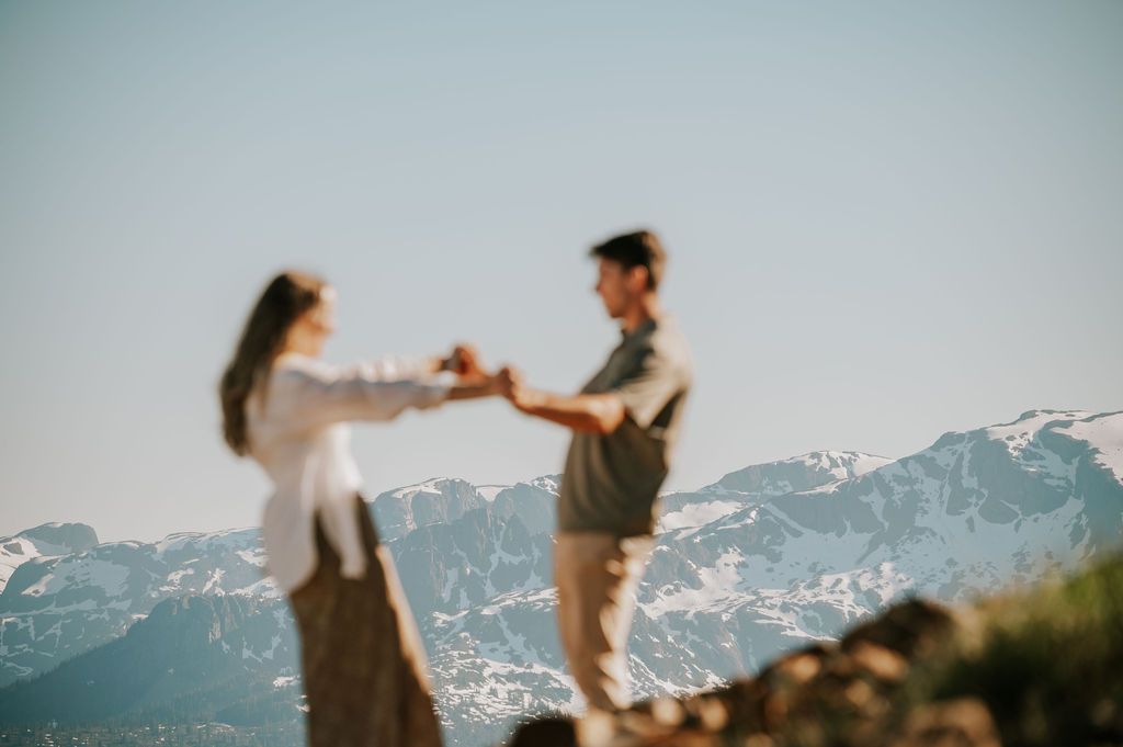 Mt Washington Couple Adventure Photo holding hands in front of glacier. Photography by Photographer Soulfull Photographs