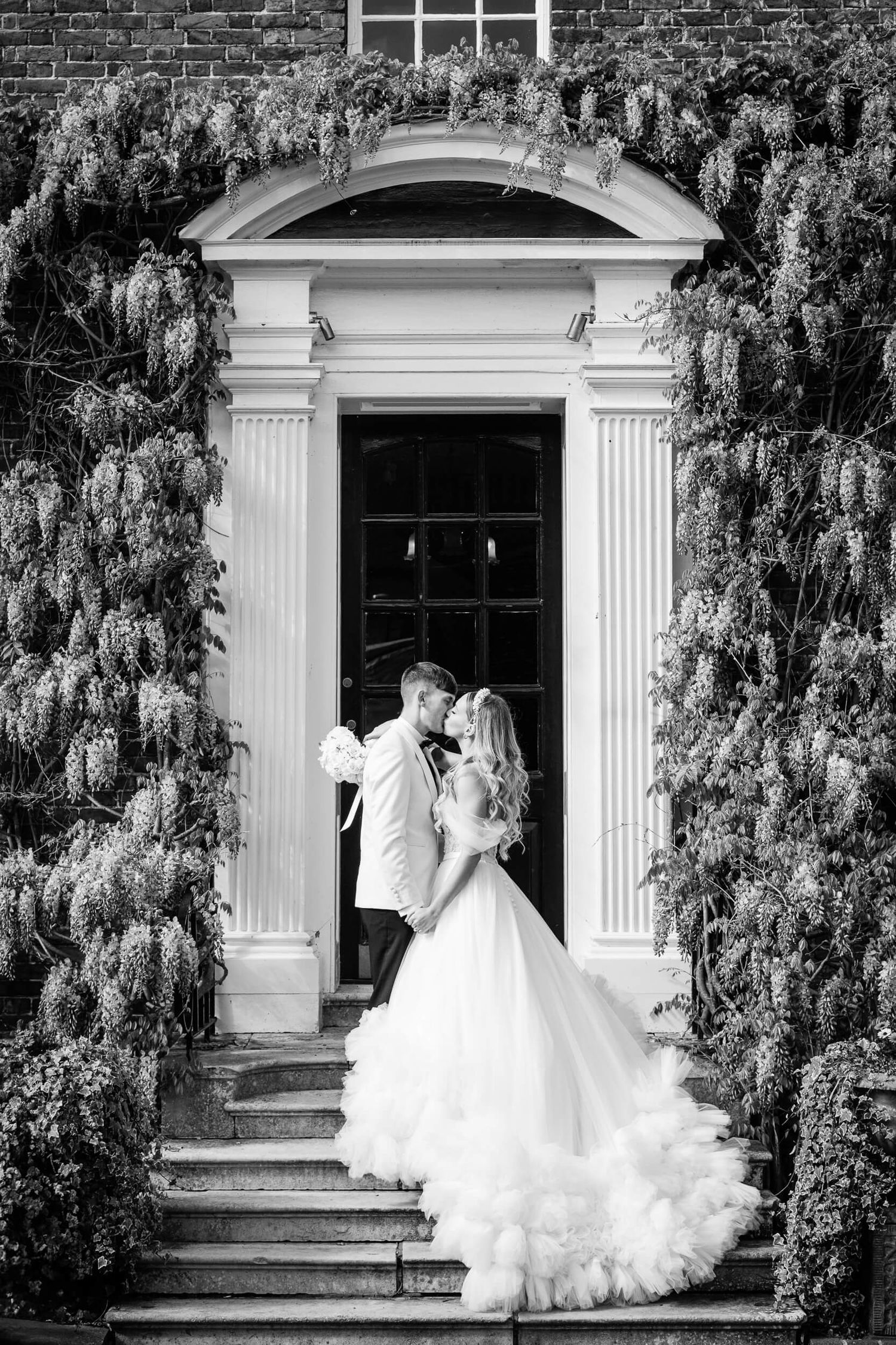 Bride and groom married at the Orangery in Maidstone Kent Wedding pose on steps