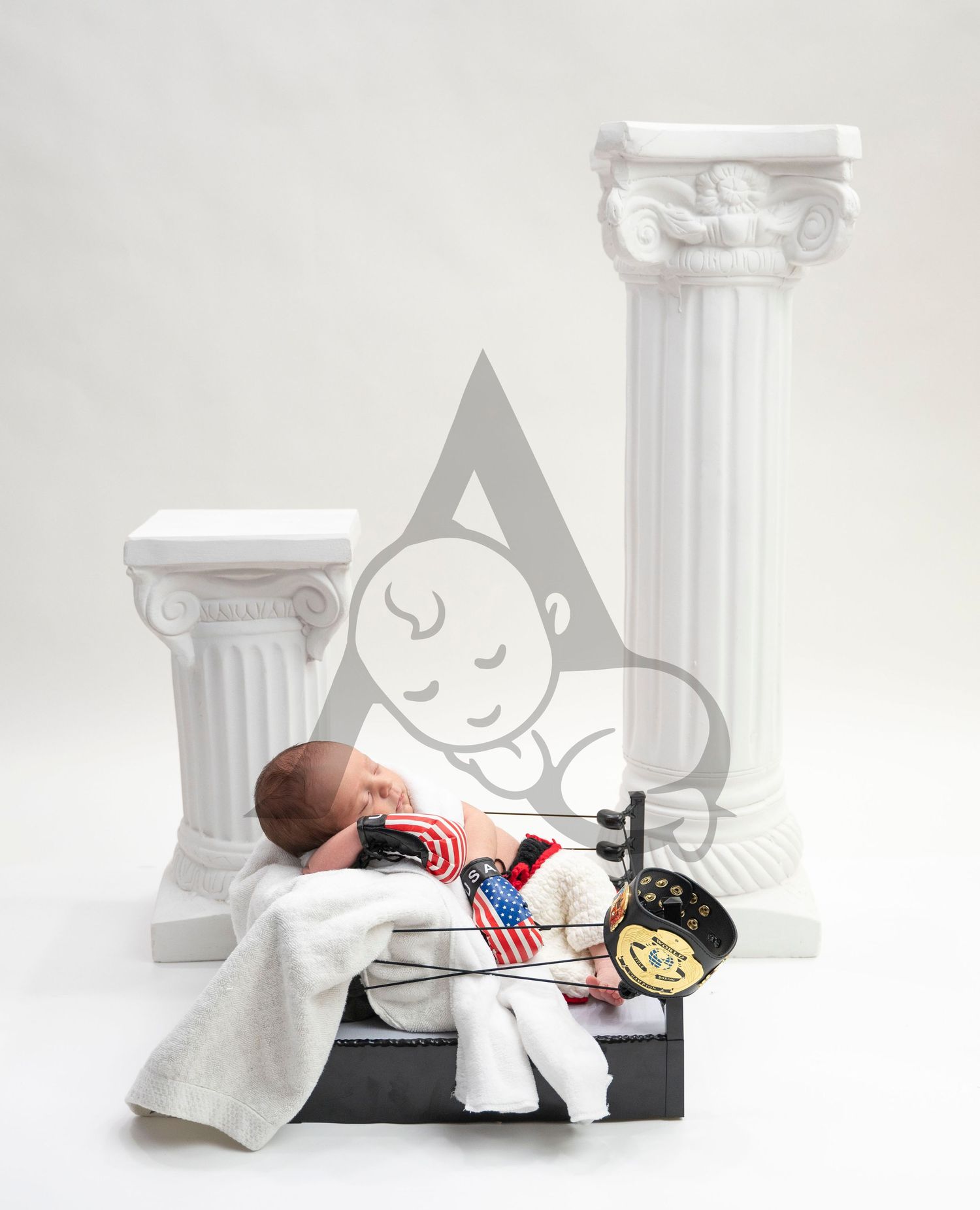 Newborn Posing in Boxing Ring on White Background