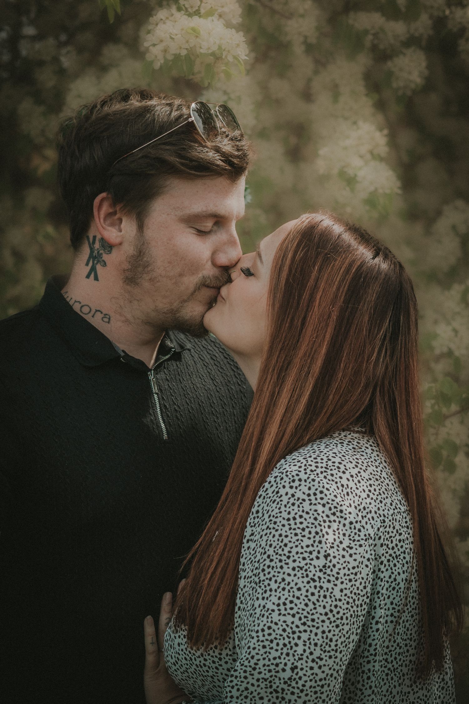 couple kissing at Needham Lake, Suffolk, in colour muted tones