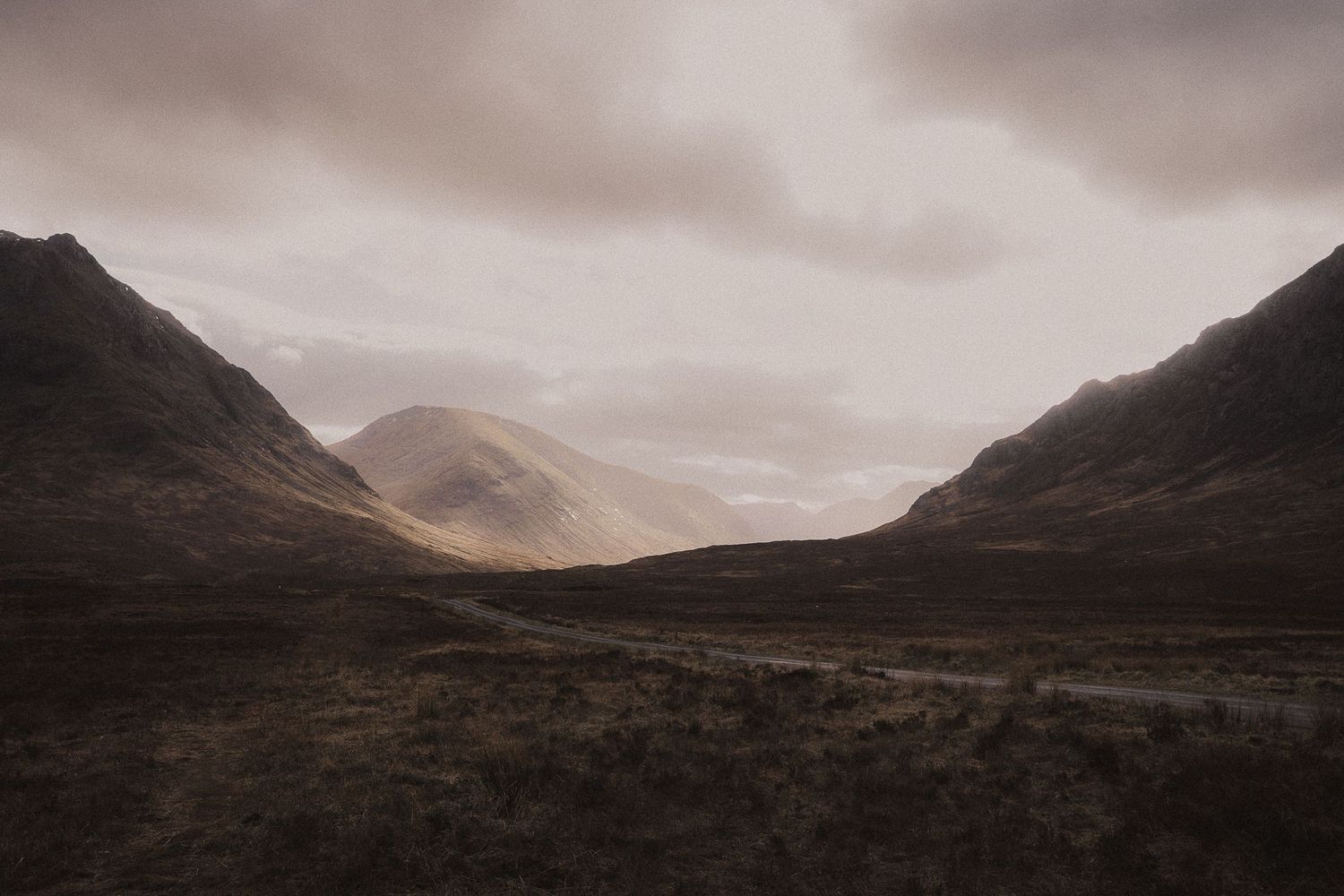 Dramatic sunset landscape of Glencoe Scottish Highlands during Elopement in Nature