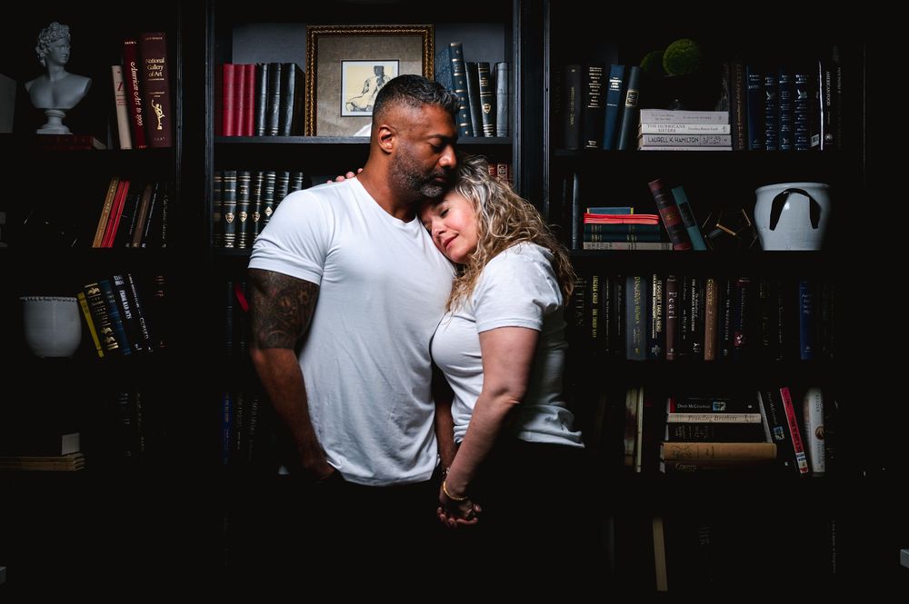 Series of intimate romantic moments captured in a library setting with bookshelves and natural lighting.