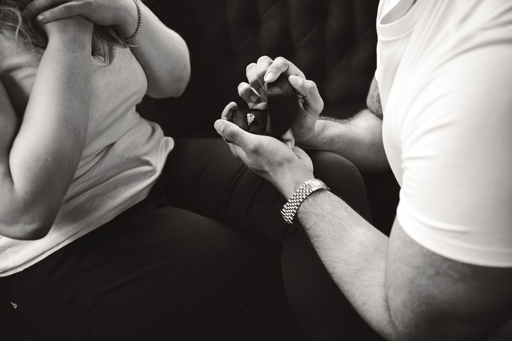 Three artistic monochrome photos showing close physical touch and intimacy between two people on a dark background.