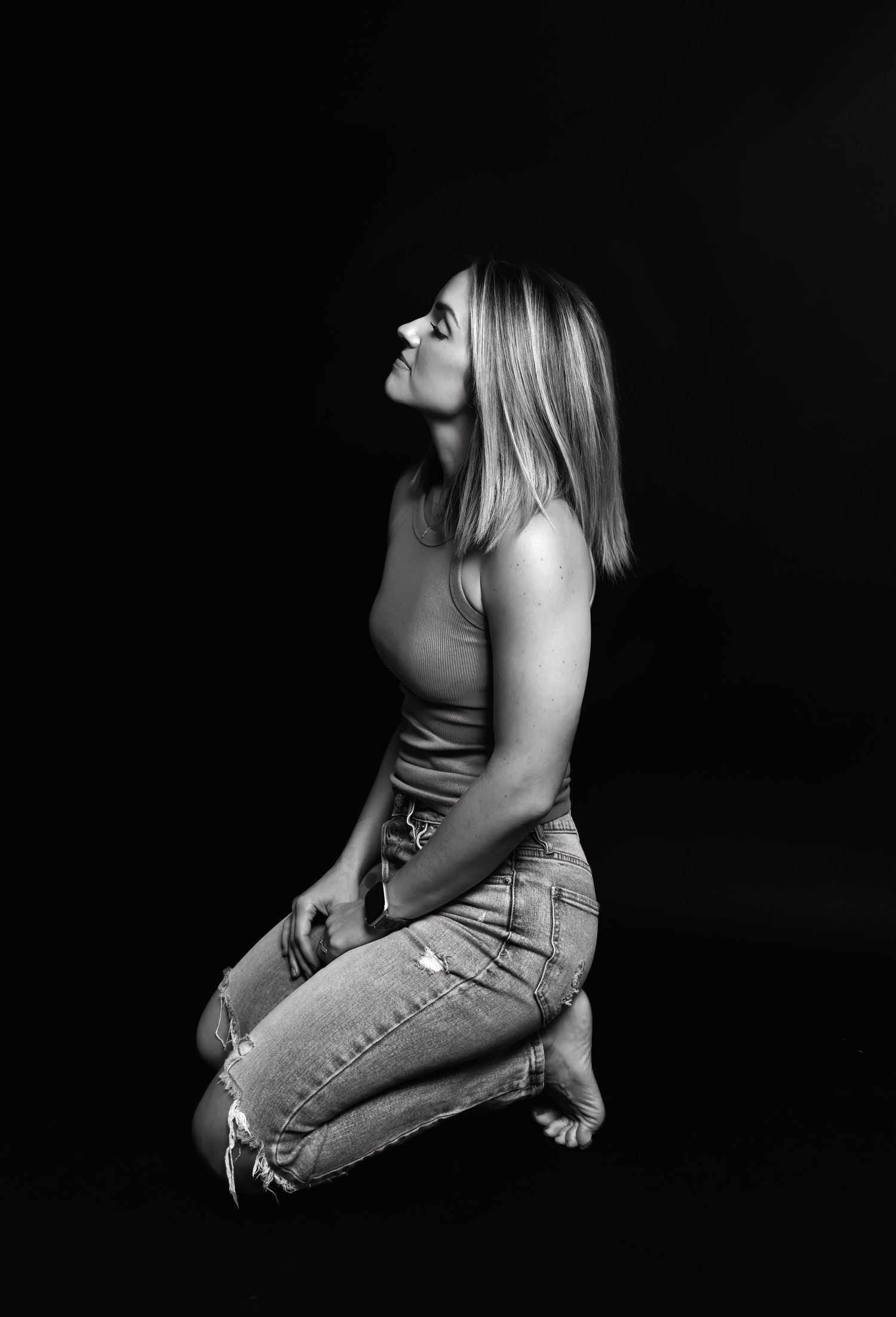 A series of black and white dramatic portrait photos showing different emotional expressions and poses.