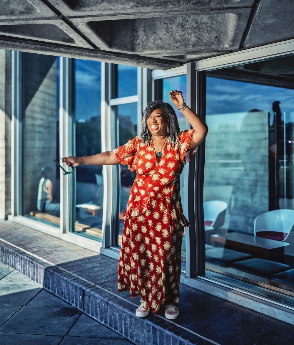 A sequence of images shows a woman dancing energetically in front of large windows in a modern sunlit interior space.
