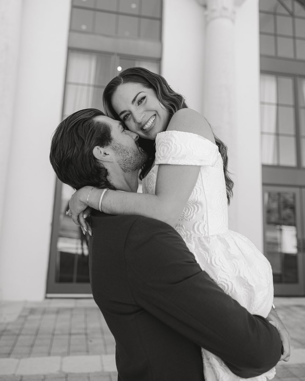 Black and white portrait capturing a tender moment between a couple.