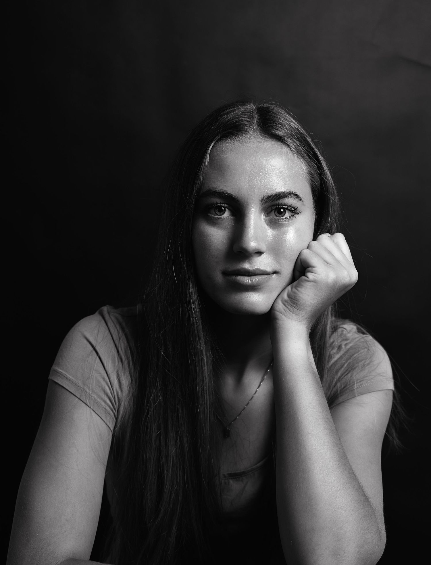 A series of black and white dramatic portrait photos showing different emotional expressions and poses.