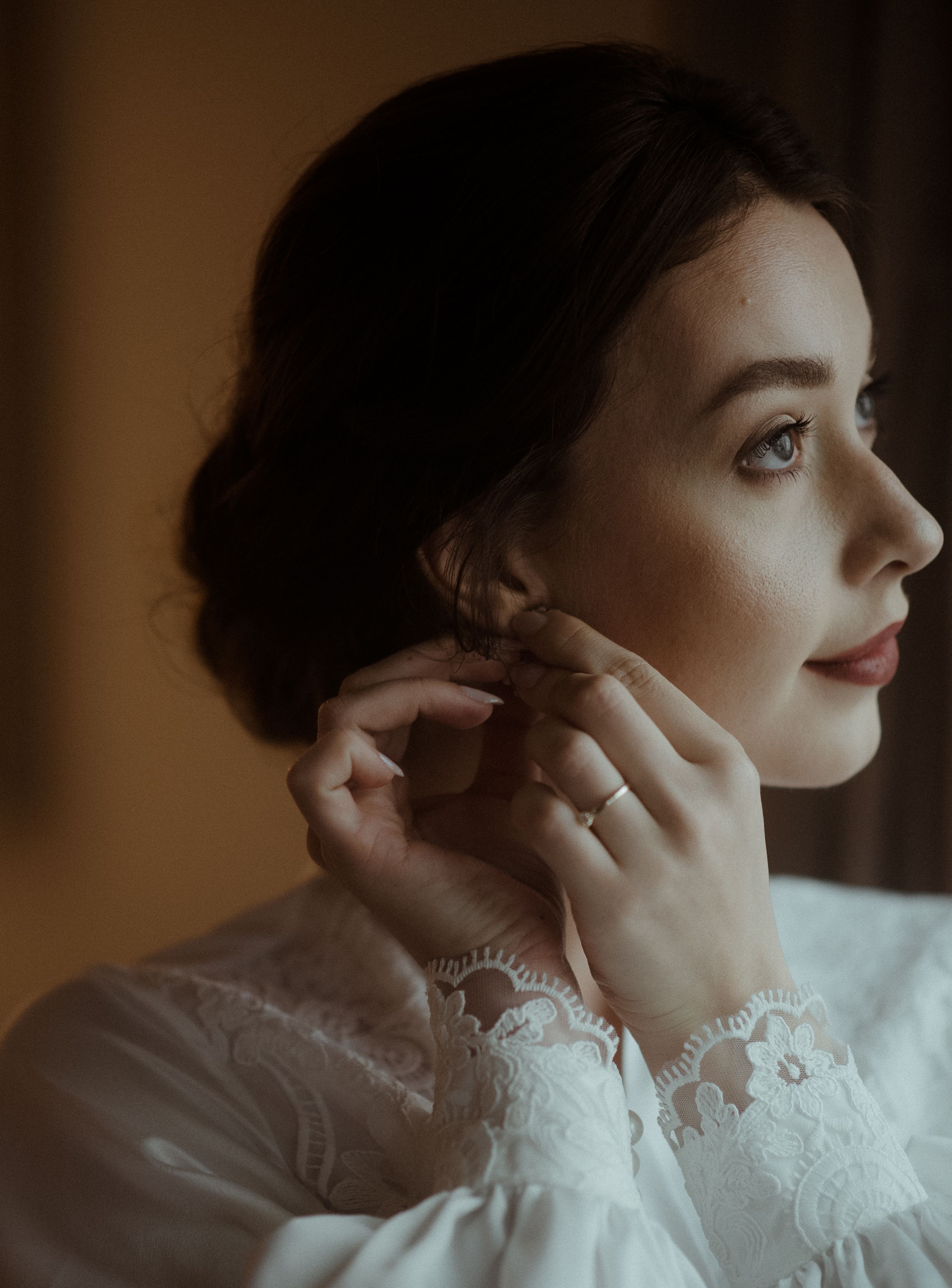 Elegant portrait showing delicate lace details and vintage-inspired wedding attire.